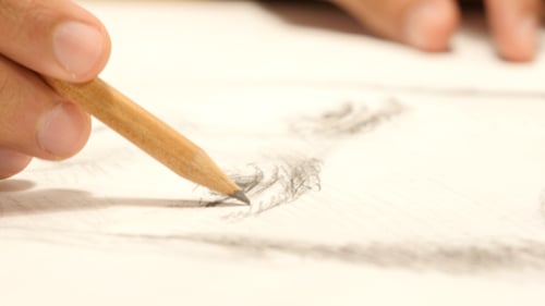 Hand Drawing With Pencil on White Paper