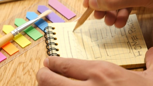 Hand Drawing Wireframe Web Design in Notebook