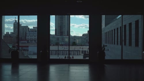 Cityscape View Through Large Windows from Inside Building