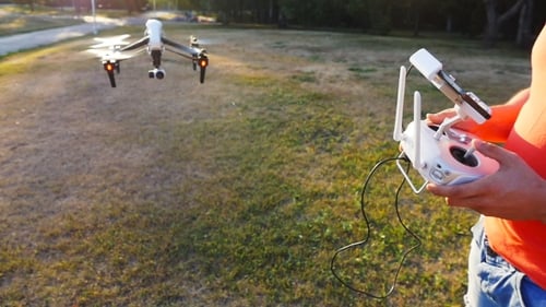 Drone Flying in a Field, Remote Control Operated