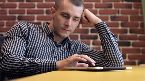 Man Working On A Tablet