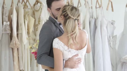 Romantic Couple Dancing Gracefully in Bridal Boutique
