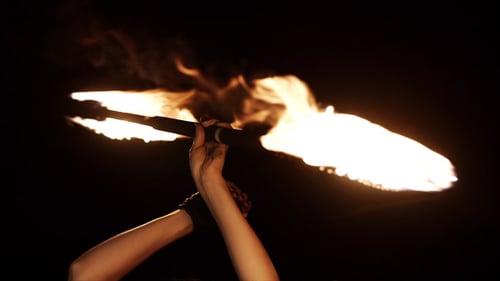 Captivating Fire Poi Performance at Night