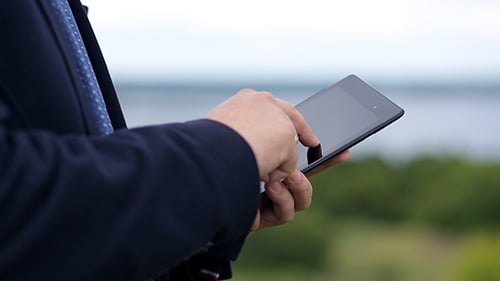 Man Uses Tablet Outdoor