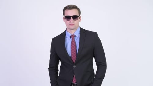 Adult in Business Suit Wearing Sunglasses