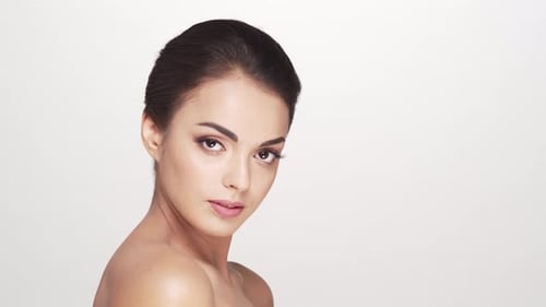 Studio portrait of young and beautiful brunette woman over