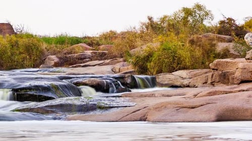 Wild Mountain River Flowing with Stone Boulders and Stone Rapids