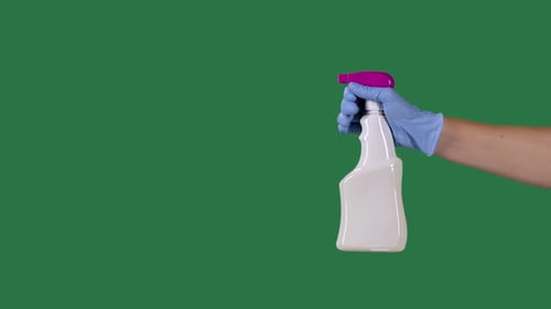 Man in Protective Gloves Sprays a Cleaning Hygienic Spray for Disinfection and Prevention of COVID