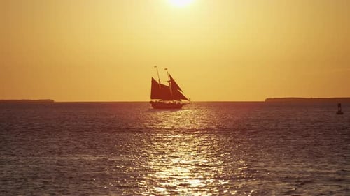 Sailboat Sailing the Ocean at Sunrise