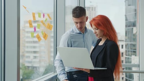 Business People Brainstorming with Laptop in Modern Office