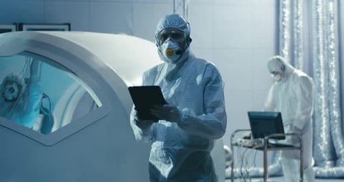 Engineer Turning To Camera in Clean Room