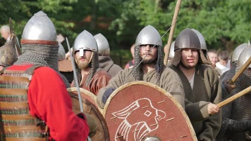 Group of Warriors Dressed for Battle Standing Outdoors