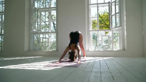 Woman Doing Yoga in Bright Sunny Room