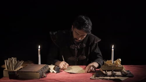 Man Writing with Quill by Candlelight in Dark