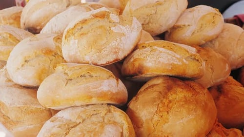 Pile of Freshly Baked Bread Loaves