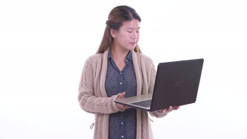 Smiling Woman Using Laptop Indoors
