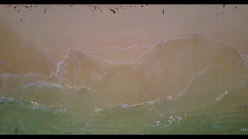 Aerial drone shot scenery of perfect shore beach voyage by blue ocean and white sand background of a