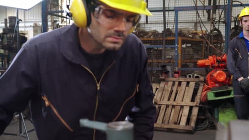 Smart Factory Worker Using Machine in Factory Workshop