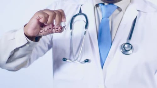 Doctor Writes The Word Success On Glass Surface