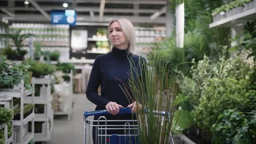 Pretty Young Woman in a Plant Store