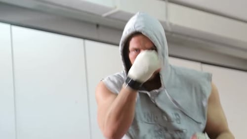Boxer Throwing Punches Close Up in Training