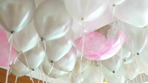Helium Balloons Clustered at a Birthday Party