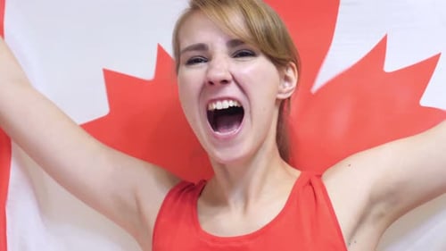 Woman Cheering Holding Canadian Flag