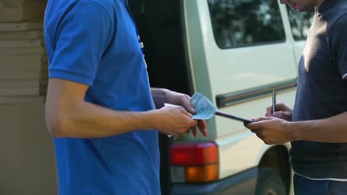 Man Signing in Blank and Paying for Parcel Receiving, Express Delivery Service