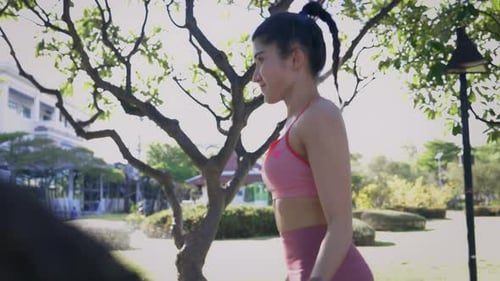 Woman Doing Rope Skipping in the Park