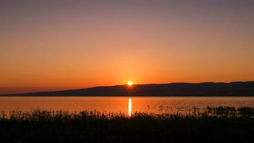 Picturesque Sunset Over a Calm Lake