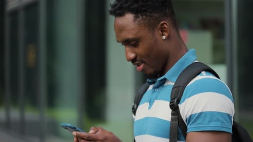 Close Up African American Young Attractive Man Using Phone on Street