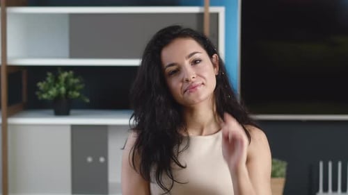 Smiling Young Woman Brunette Looking at Camera at Home Office. Happy Millennial Female with Pretty
