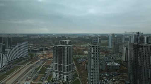 Construction of modern multi-storey buildings. Construction of a new city block.
