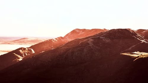 Winterliche Berglandschaft bei Sonnenuntergang