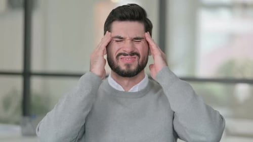 Man Experiencing Intense Headache, Massaging Temples
