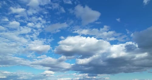 Bright Blue Sky With White Clouds Moving
