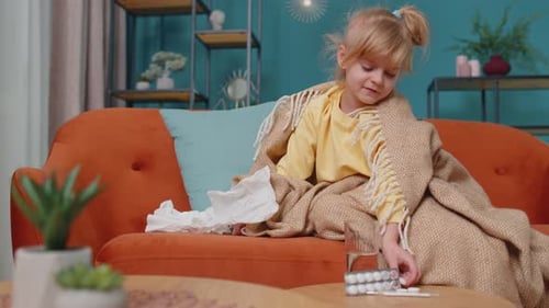 Sick Child Coughing and Resting at Home