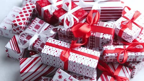 Christmas Concept. Close Up on Festive Paper Wrapped Gifts with Ribbon