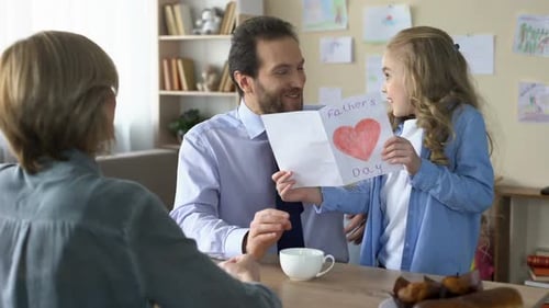 Happy Family Celebrates Father's Day at Home