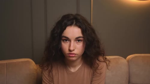 Confident Young Woman Looking at Camera Standing at Home Office