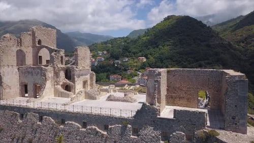 Aerial View of Ancient Fortress in Medieval Italian Village on Hill Top Overlooking Mountains Gorge