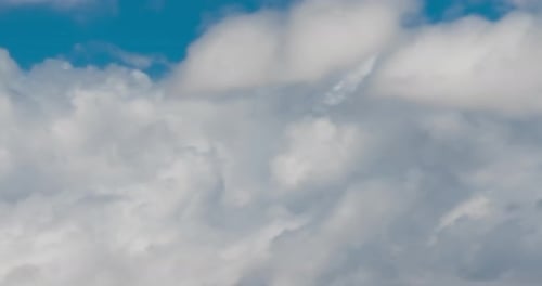 Clouds Moving Across the Blue Sky