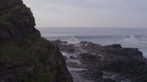 Ocean Waves Crashing Against the Rocky Shores of the Coastline
