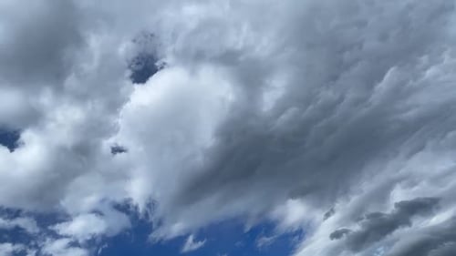 Dramatic Time-Lapse of Billowing Clouds in Blue Sky
