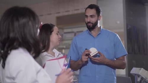 Medical Professionals Conferring in a Doctor's Office