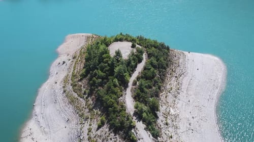 Light blue river with a pier, top view in 4k. Aerial View of Boreal Nature Forest and River