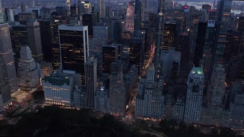 Manhattan Skyline at Night with Flashing City Lights in New York City