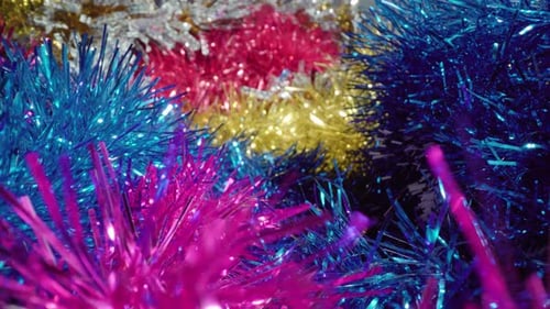 Motion Over Christmas Tree Tinsel Ornaments in Studio