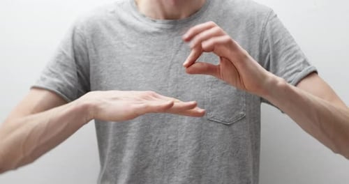 Hands Gesturing Shapes Against a White Backdrop