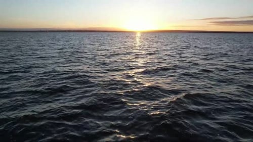 Aerial View of Calm Ocean at Sunrise